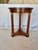 Found in the South of France, this Early 20th Century French Walnut Empire Style Side Table dates back to the early...