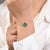 This modern Malachite clover-shaped chain bracelet features vibrant, green Malachite stones set in a sleek, contemporary...