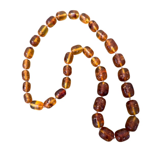 Such a great vintage amber resin necklace! Perfect from day to night…enjoy! Place in a bowl for decorative accents!
