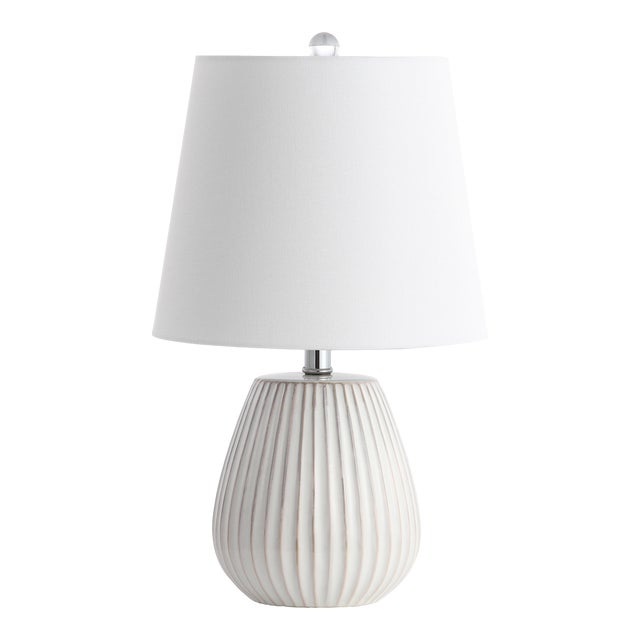 The sculptural style of this contemporary table lamp elevates any living room with it's minimalist design. it's finely...
