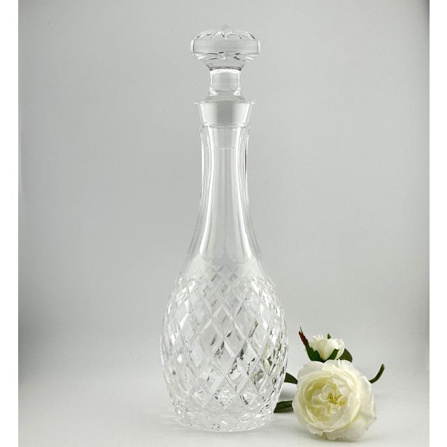 Elegant Waterford crystal cordial decanter in the classic Comeragh pattern, introduced by Waterford in 1974. This timeless...