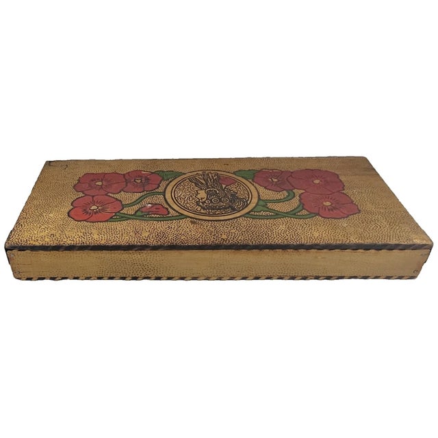 This striking early 20th-century Flemish-style pyrography box showcases the romance and organic elegance of the Art...