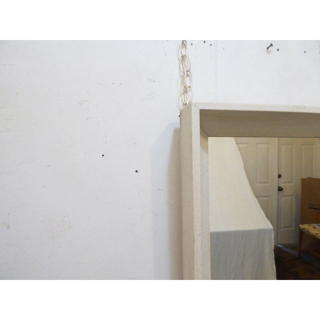 This modern whitewashed mirror has a slight pebbly textured finish and a scoop coved profile. It measures 46.75"H x 33"W....