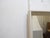 This modern whitewashed mirror has a slight pebbly textured finish and a scoop coved profile. It measures 46.75"H x 33"W....