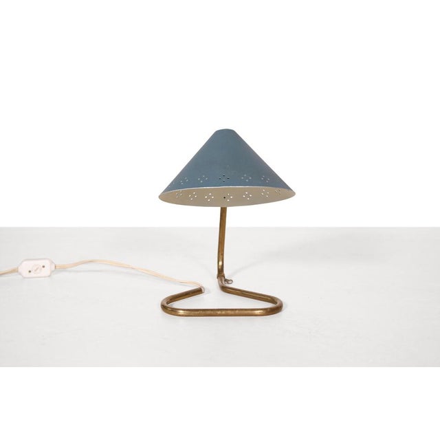 Nice table or desk lamp which can also be hung on the wall as a wall lamp. This lamp was designed by Erik Wärna and...