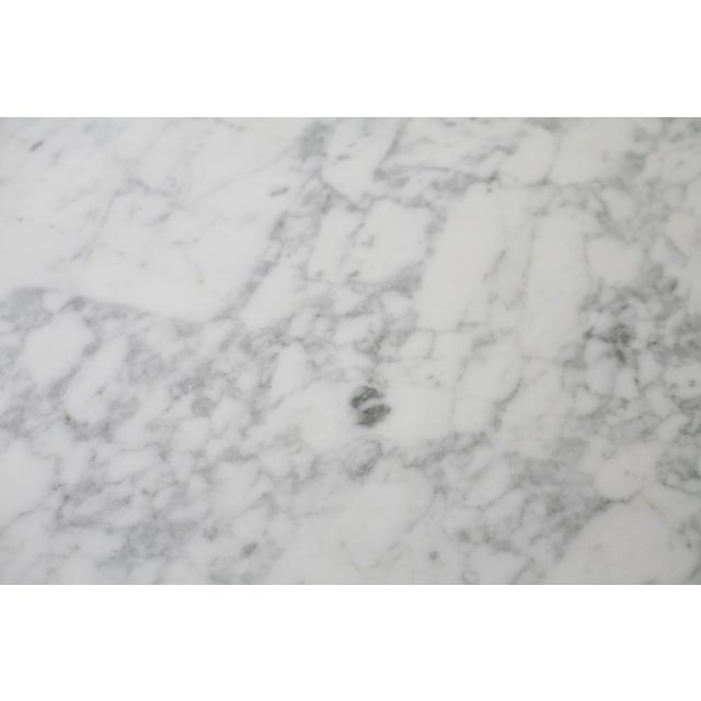 Marble and steel table. France, Circa 1970 Very often attributed to Florence Knoll / Roche Bobois. In very good condition....