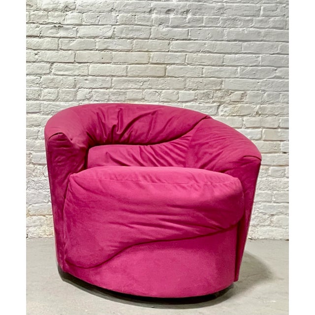 A striking blend of Postmodern and Mid Century Modern design, this Vladimir Kagan styled swivel lounge chair features bold...