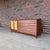 A beautifully designed Mid-Century Modern credenza from the Wonderwood collection by American of Martinsville. This line...