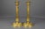 A beautiful pair of antique French Restauration style brass candlesticks with removable bobeches (drip trays) from ca....