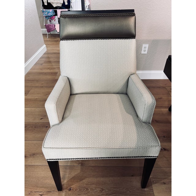 Michael Weiss Phelps Side and Arm Chairs. 2 arm chairs and 8 side chairs. Fabric natural color with leather top and...