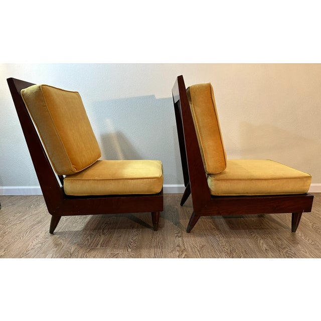 A pair of mid-century modern New Hope Style lounge chairs, featuring nice deep frames, a solid wood base, with tapered and...