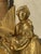 "Gilt Bronze Clock " A very pretty gilt bronze clock depicting a young woman playing a musical instrument. It is in...