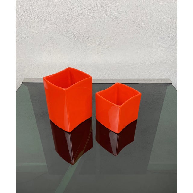 Set of two vases in orange ceramic in different heights made by Franco Bettonica for Gabbianelli, Italy, 1970s. Both of...
