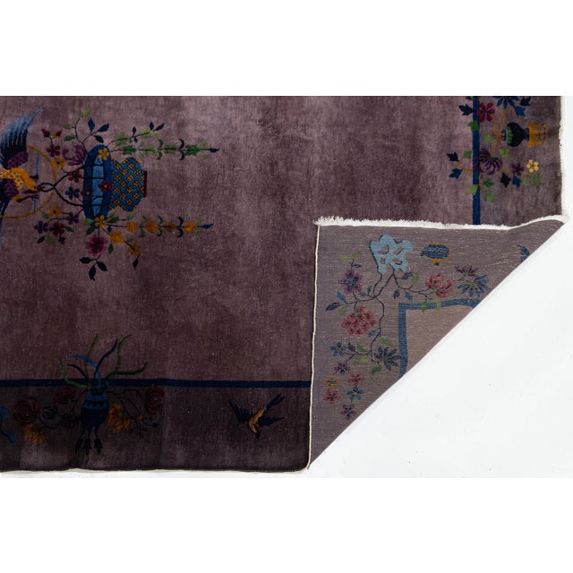 This stunning Antique Chinese Art Deco wool rug (circa 1920s) features a rare, saturated plum or "aubergine" field that...