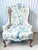 Fabulous vintage wingback chair. Features crewel embroidery in a floral pattern. Blues and off white. Velvet back. Made by...