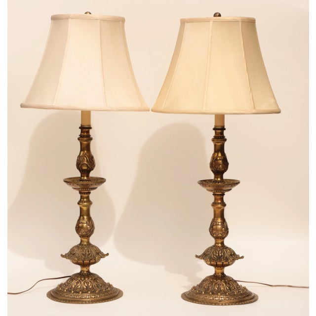 These tall, E.F. Caldwell-style table lamps are solid bronze with a lustrous golden finish. They have an acanthus leaf...