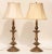 These tall, E.F. Caldwell-style table lamps are solid bronze with a lustrous golden finish. They have an acanthus leaf...