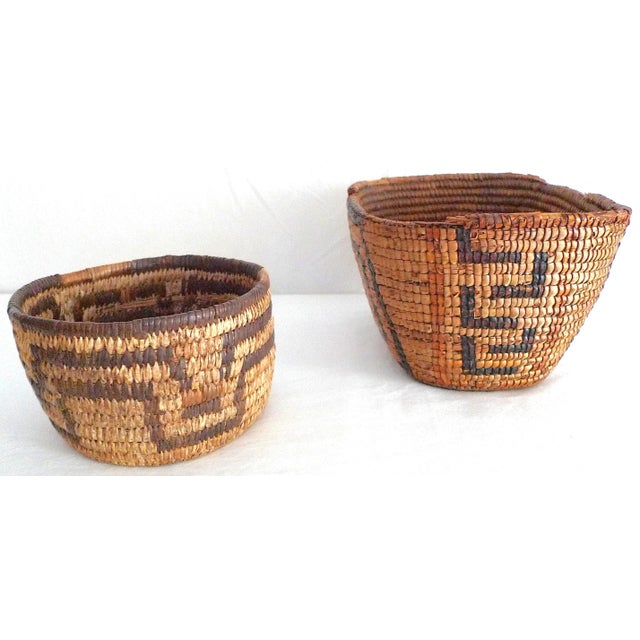 Offered are two early 20th century Native American style baskets, each complements the other with similar geometric...