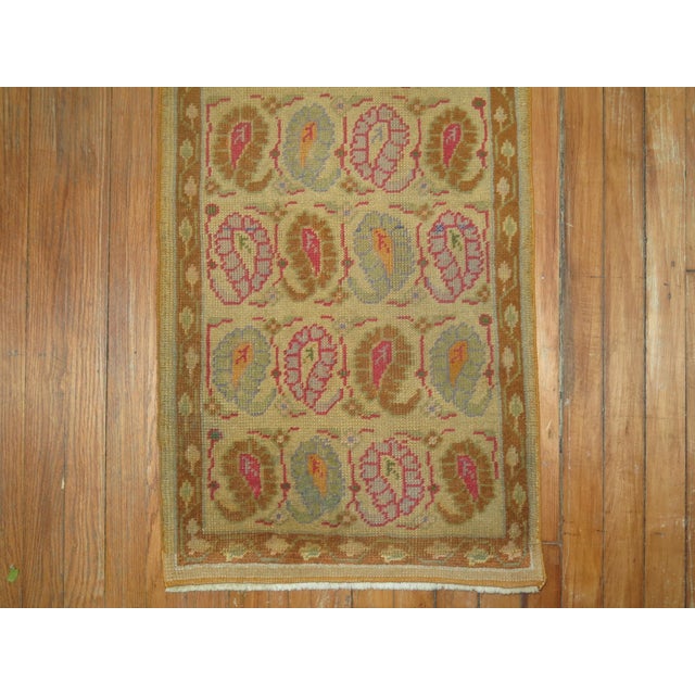 One of a kind small Turkish runner with colorful paisley design in predominant lavender and hot pink accents. 1'9'' x 5'10''