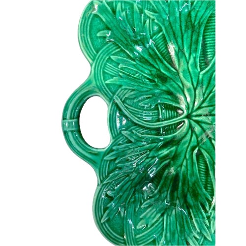 Antique Wedgwood green majolica leaf dish with handle. Marked "Wedgwood, S, E, UPO," on the underside.