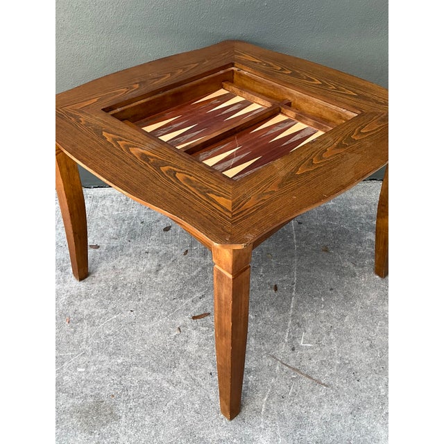 Elevate your entertainment space with this versatile vintage reversible game table. Crafted with a handsome, high-contrast...
