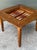 Elevate your entertainment space with this versatile vintage reversible game table. Crafted with a handsome, high-contrast...