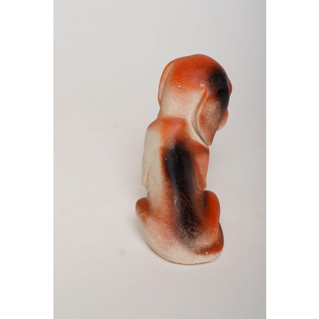 Circa 1950s American painted chalkware puppy figurine. These pieces date back as far as the 1800s and were often used as...
