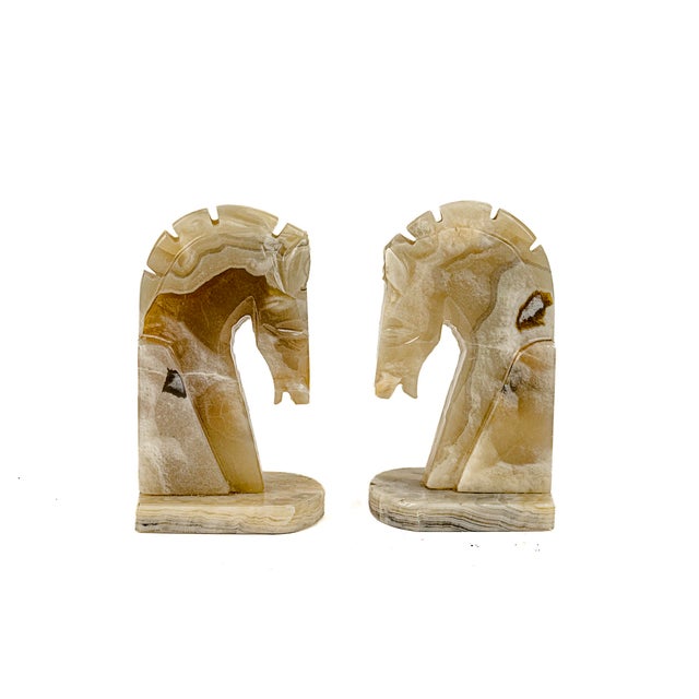 Vintage Mid-Century Modern Hand Carved Honey Onyx Horse Head Bookends featuring a smooth, polished finish with natural...