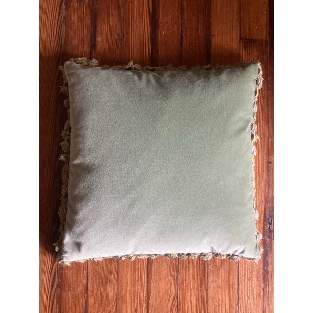 Very pretty authentic 19th century down filled French Needlepoint pillow. It has beautiful fringes and the back is velvet....