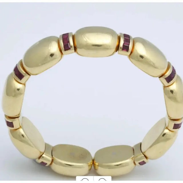 Signed Faraone 18kt Expandable Cuff made up of 9 segmented oval sections, each separated by curved bars set with 5 French-...