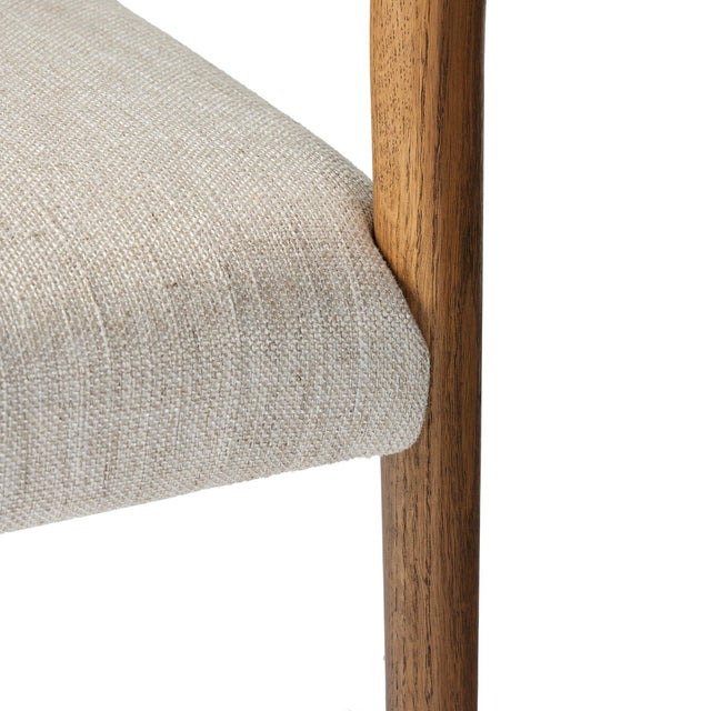 Textured materials redefine the classic ladderback chair, with a smoked oak frame and a comfortable seat of cotton and linen.
