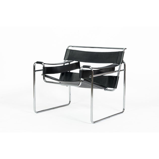 This vintage mid-century modern Wassily lounge chair designed by Marcel Breuer is from the 1970s. This vintage chair...