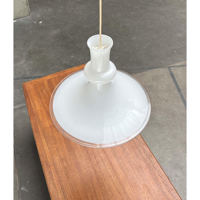 Danish glass pendant lamp by the renowned manufacturer Holmegaard / Royal Copenhagen, designed by Michael Bang in the...