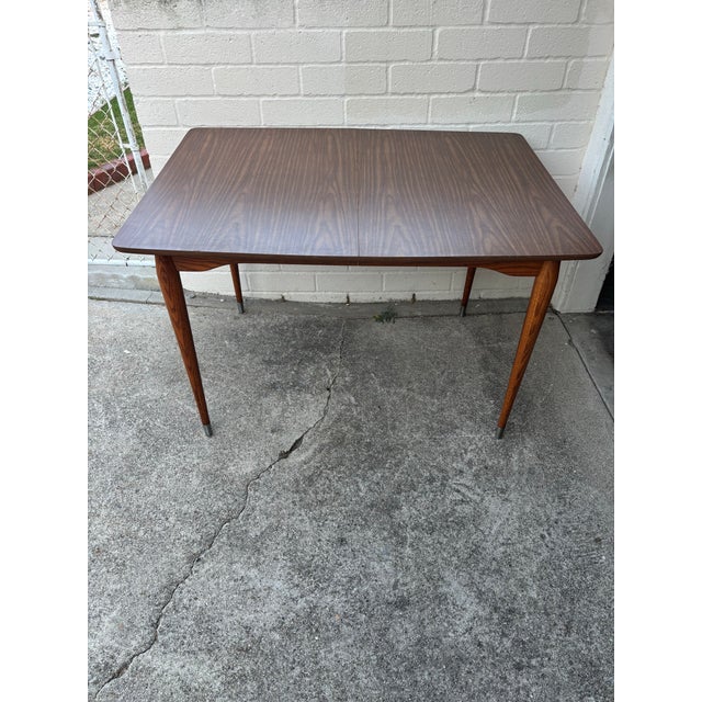 Vintage Mid-Century Modern Wood and Formica Dining Table Featuring Tapered Legs With Metal Tips. For Sale - Image 11 of 11