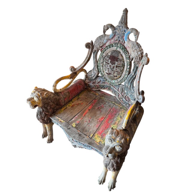 29”W x 40”H x 28”D Seat Width: 20” Seat Depth: 22” Seat Height: 12 3/4” Arm Height: 22 1/2” Hand-carved wood with remnants...