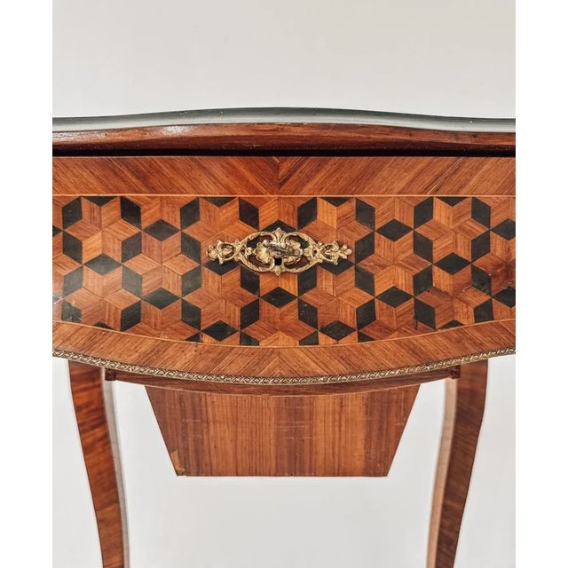 A small masterpiece of 19th-century craftsmanship, this Louis XV / Louis-Philippe vanity table combines French charm with...