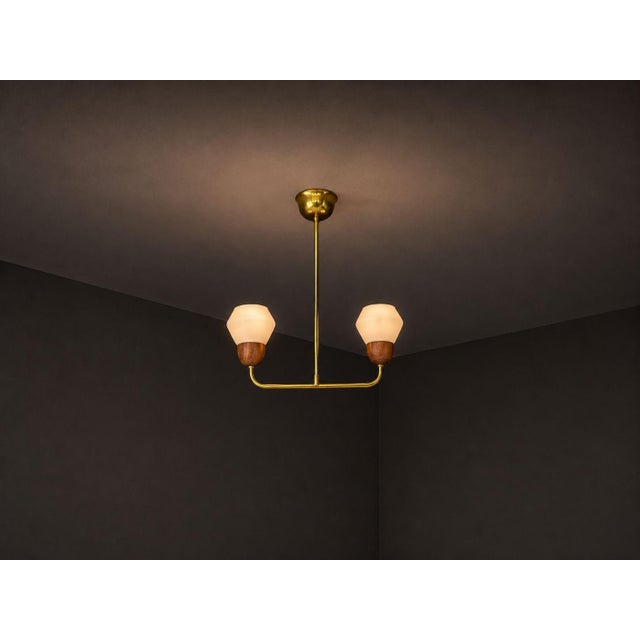 Swedish Mid-Century Modern, Pendant Light or Chandelier, Teak, Opal Glass, Brass, Sweden, 1960s An interesting two (2)...