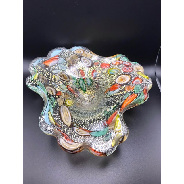 he object is a very pretty Murano free form hand blown shallow bowl that contains gold flecks and made from many colorful...