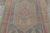 This vintage 4x6 Turkish, circa 1950–1959, features a bold geometric medallion design in soft beige, sky blue, and blush...
