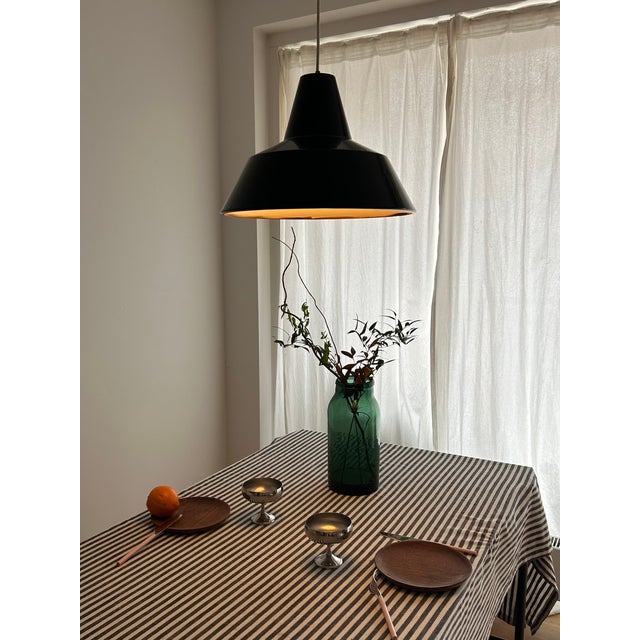 Danish industrial lighting from the 1970s — this vintage pendant lamp by asger bay christiansen for lys combines a strong...