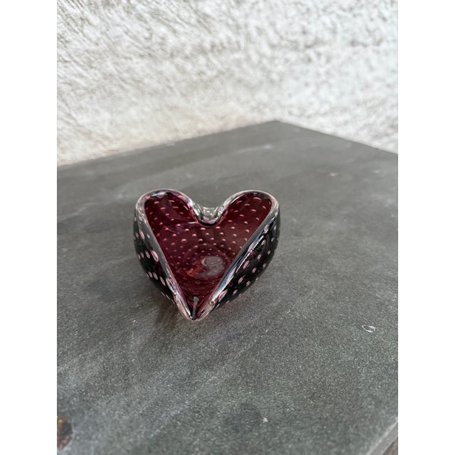 Hand blown glass heart shaped ashtray with captured bubbles attributed to Murano glass, Italy. The ashtray is not marked.