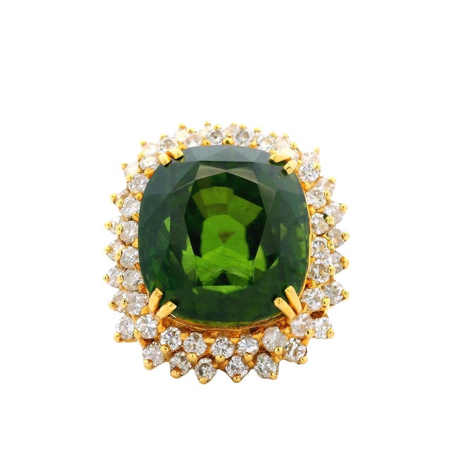 A breathtaking oversized Cocktail ring showcasing a rare and vibrant Peridot gemstone. Expertly crafted in solid 18-karat...
