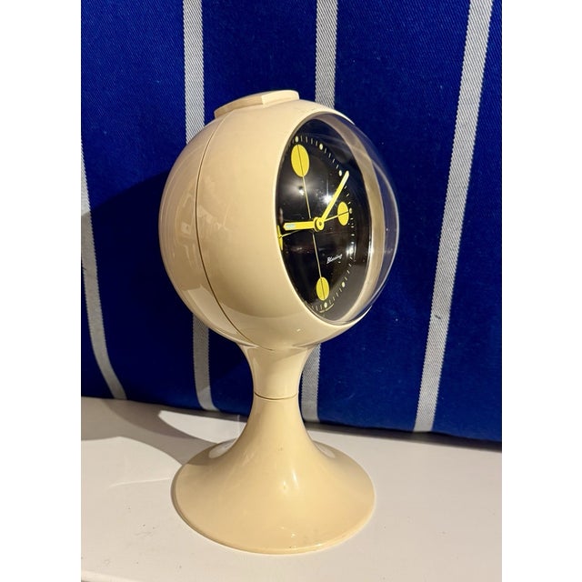 Celebrate the bold innovation of Mid-Century Modern design with this **Vintage Space Age Blessing Alarm Clock**, expertly...