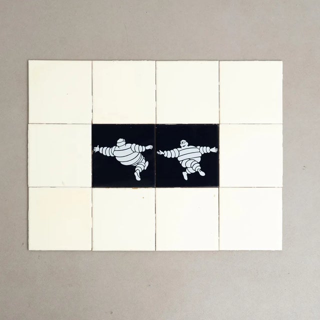 Embark on a journey of vintage charm with this exceptional set of tiles, featuring the iconic Michelin Man in a vibrant...