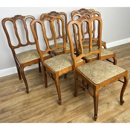 A beautiful Vintage French Louis style dining chair set , showcasing elegant curves and refined craftsmanship. The carved...