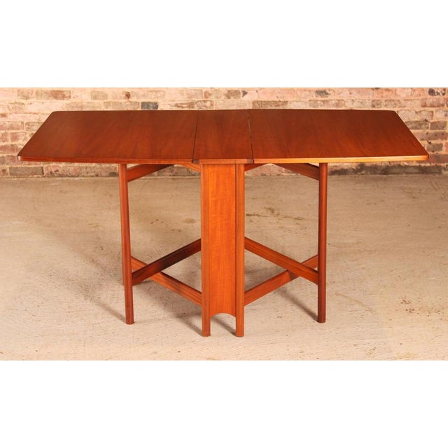 Mid Century McIntosh drop leaf dining table, circa 1970s. Excellent original condition with minor signs of use. W...