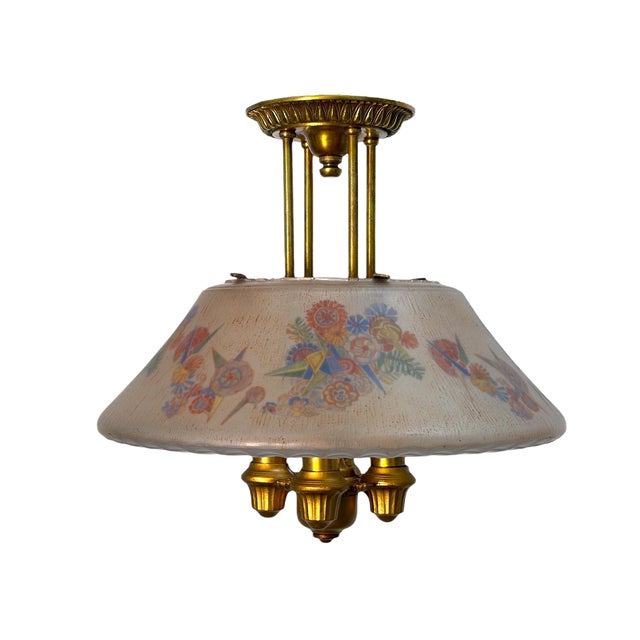 Lightolier refers to this fixture as a Dinolier in their 1928 catalog. It has a striking huge glass shade with a textured...