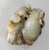 We are selling this Chinese Qing style carving of a Ram with Boys. This piece is carved from a dark celadon green-grey...