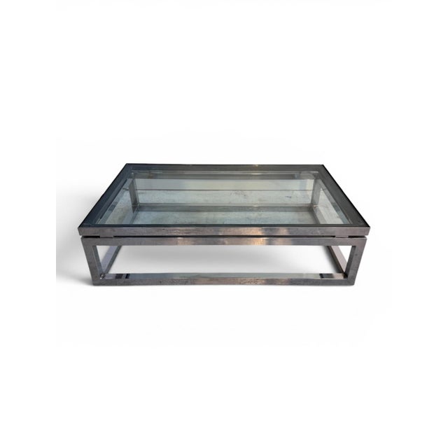 A striking example of 1970s American modernist furniture design, this chrome and glass coffee table by the American Design...
