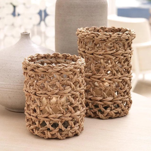 Add a fresh, natural accent piece to your home using the large Sea Grass Open Weave Hurricane With Glass Insert. This...